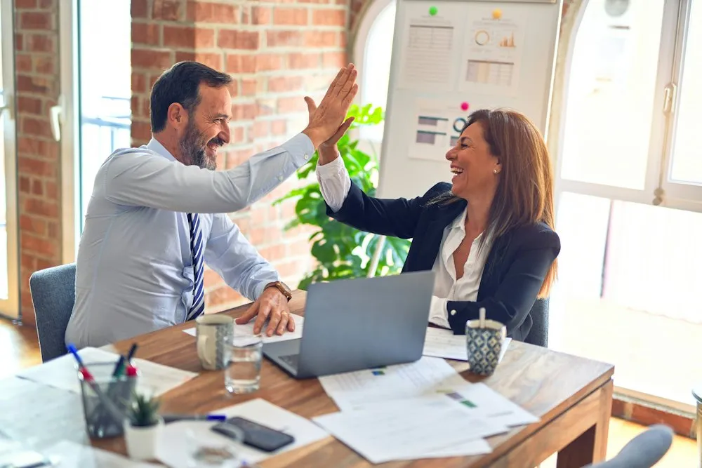 Client and consultant shaking hands on a partnership
