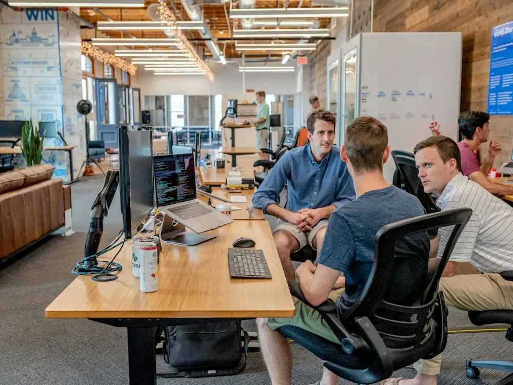 Swan Technologies consultants collaborating with a client team